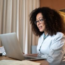 Woman chatting to someone on laptop