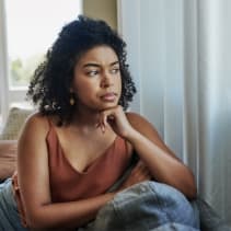 woman looking out a window