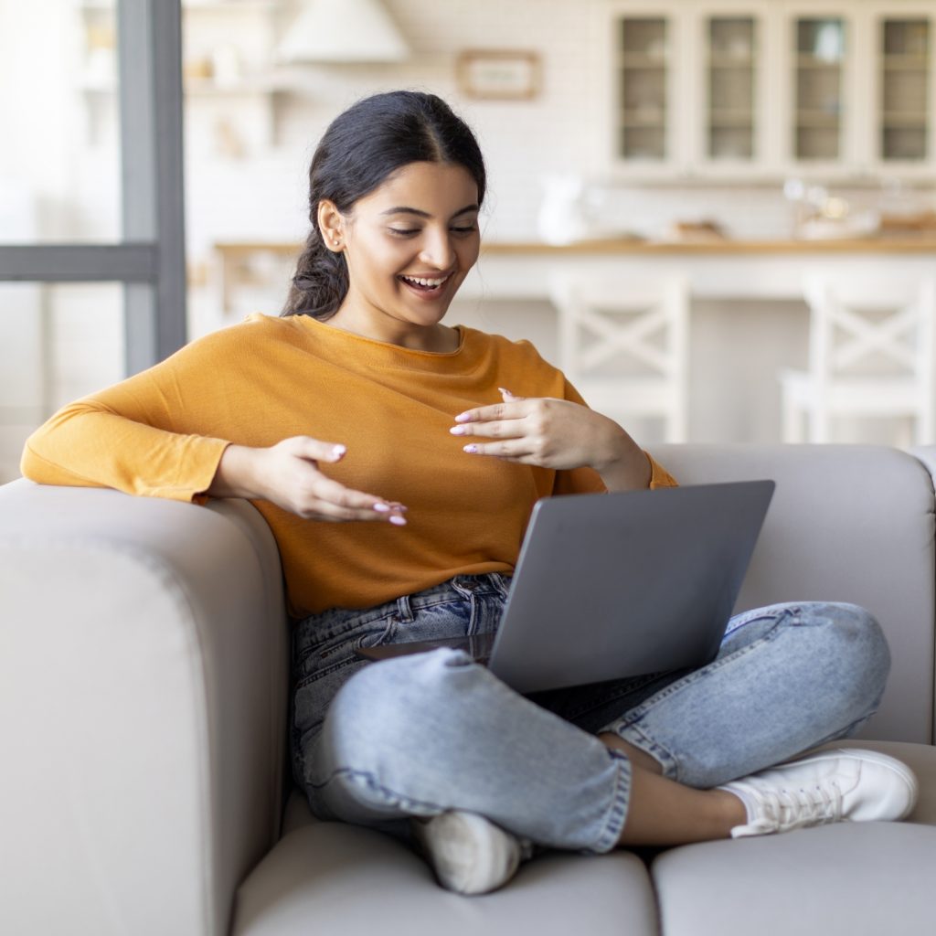 Woman talking with someone on laptop